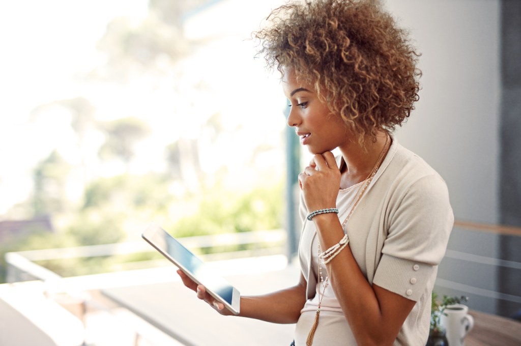 woman looking at ipad